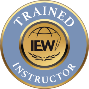 Trained IEW Instructor. Circle with Trained and Instructor written in white text. The middle has a gold circle with IEW written in black